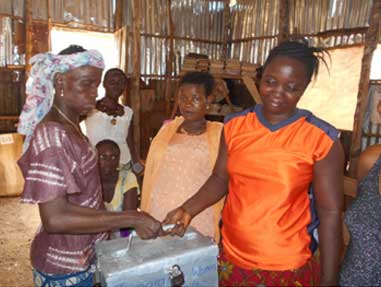 Tamemsu Women's Savings and Loan Assoc. collecting their shares in the lock box