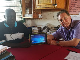 Head Teacher demonstrates newly distributed school tablets