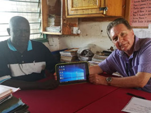 head-teacher-demonstrates-newly-distributed-school-tablets